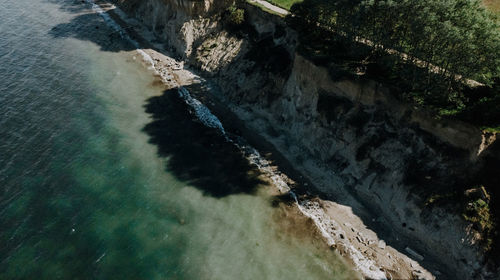 High angle view of dam amidst sea