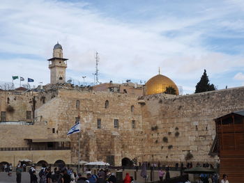 Group of people in front of historic building