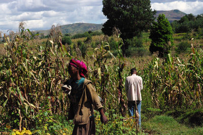 Man and woman standing on farm