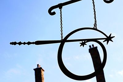 Low angle view of street light against sky