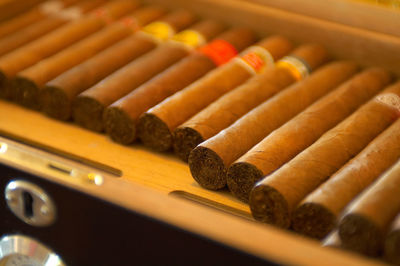 Close-up of cigar in container