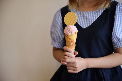 Midsection of woman holding food