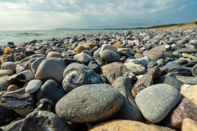 Rocks on beach against sky