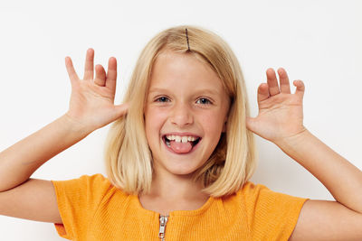 Portrait of young woman against white background