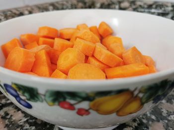 Close-up of chopped fruits in plate on table