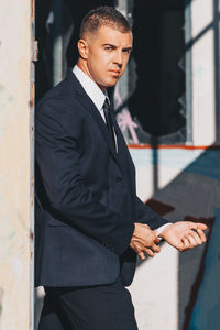 Young man standing at home