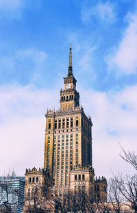 Low angle view of clock tower against sky