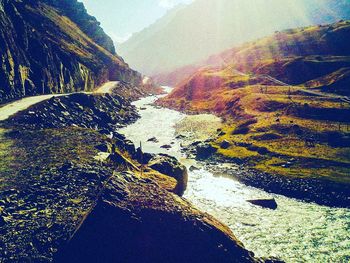 Scenic view of river amidst rocks against sky