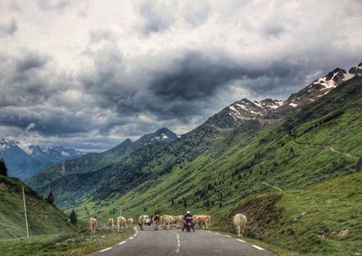 Scenic view of mountains against cloudy sky