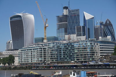 Modern buildings in city against sky