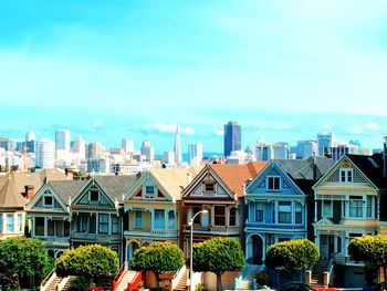 View of cityscape against blue sky