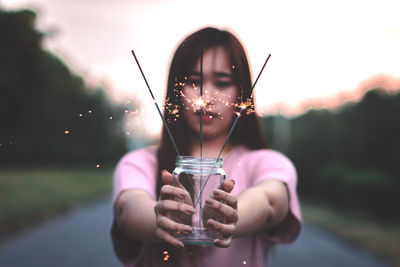 Close-up portrait of a woman drinking glass