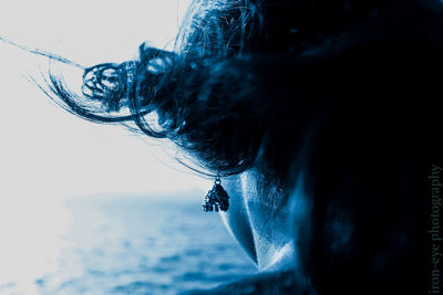 Cropped image of woman wearing earring