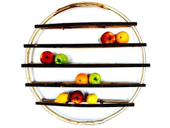 Close-up of fruits in glass on white background