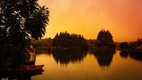 Scenic view of lake against sky during sunset