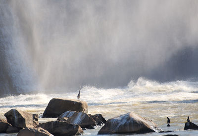 Scenic view of rocks in sea