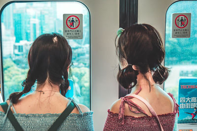 Rear view of woman with text