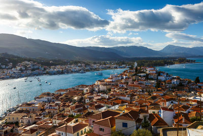 High angle view of townscape by sea