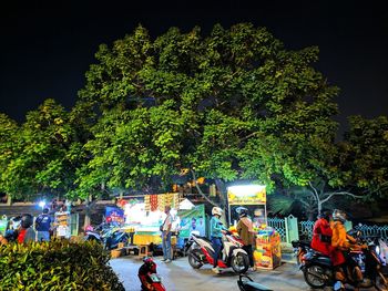 People on street in city at night