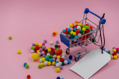 High angle view of multi colored candies in basket on table