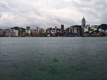 Sea against buildings in city