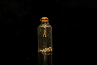 Close-up of bottle against black background