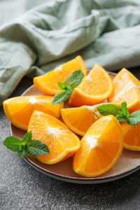 Fresh ripe oranges on dark concrete background