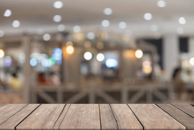 Defocused image of illuminated lights on table at night