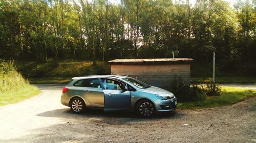 Car on road against trees