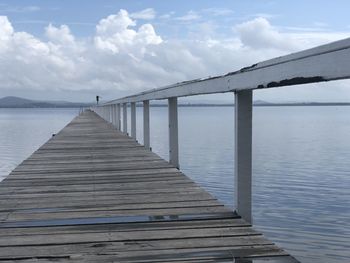 Pier over sea against sky