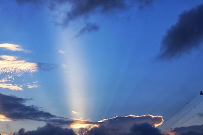 Low angle view of vapor trails in sky