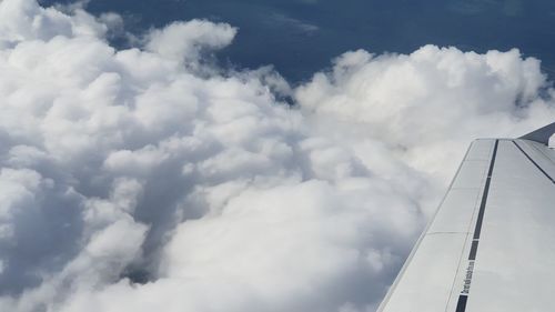 Low angle view of airplane flying in sky
