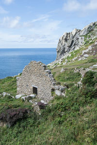 Scenic view of sea and buildings against sky