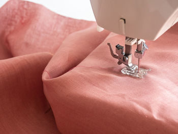 Close-up of fabric and sewing machine