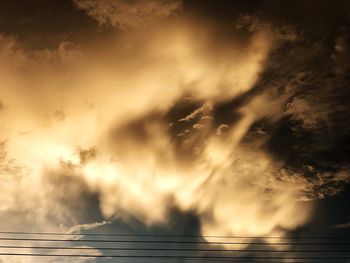 Low angle view of dramatic sky during sunset
