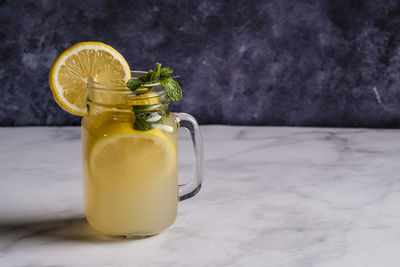 Close-up of drink in glass jar on table