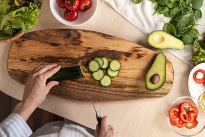 Directly above shot of person preparing food on cutting board