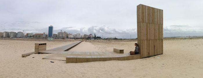 Man on sand against sky