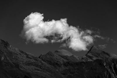 Smoke emitting from volcanic mountain against sky