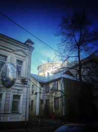 Low angle view of built structure against blue sky