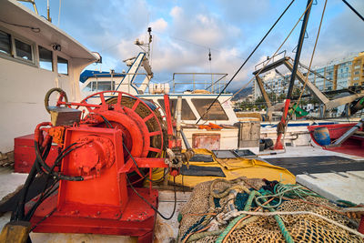 Fishing net on boat against sky