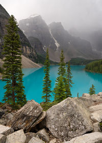 Scenic view of lake and mountains against sky