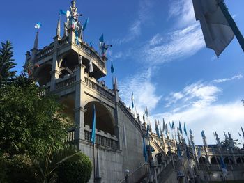 Low angle view of building against cloudy sky