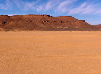 Scenic view of desert against sky