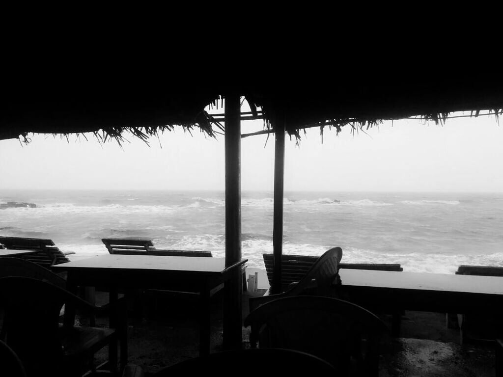 CHAIRS AND TABLE AT BEACH