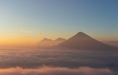 Scenic view of mountains against sky during sunset