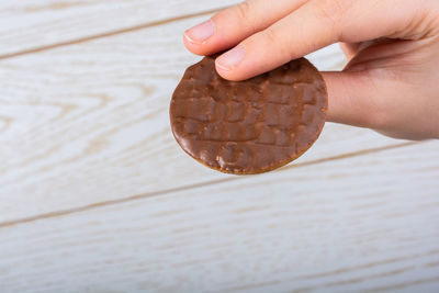 Midsection of person holding ice cream