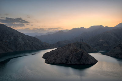 Scenic view of lake against sky during sunset