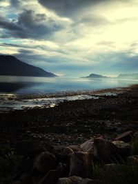 Scenic view of sea against cloudy sky