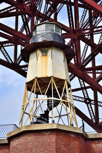 Low angle view of water tower against sky